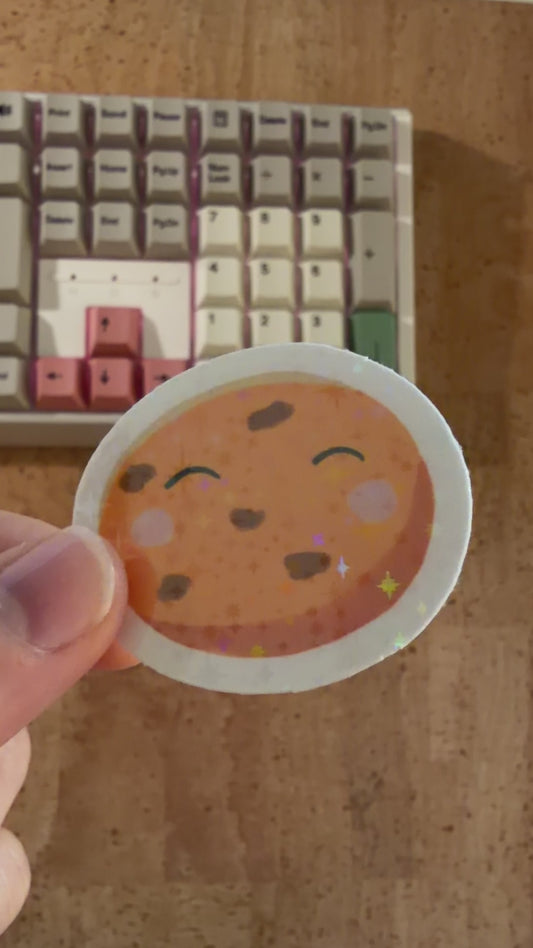 Holografischer Sticker Space Cookie – Funkelnder Keks mit Sternen – Wasserfest – Süßer Aufkleber für Laptop & Journal – Kawaii Holo